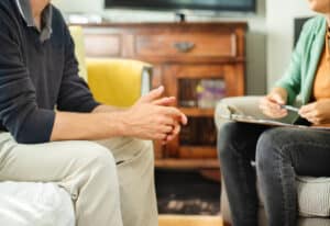 Trusted Emotional Support Animal (Esa) Letter Services | Kansas And Missouri 18 Close-up of a mental health counselor talking with a male client in her office during a therapy session at Clarity Counseling.